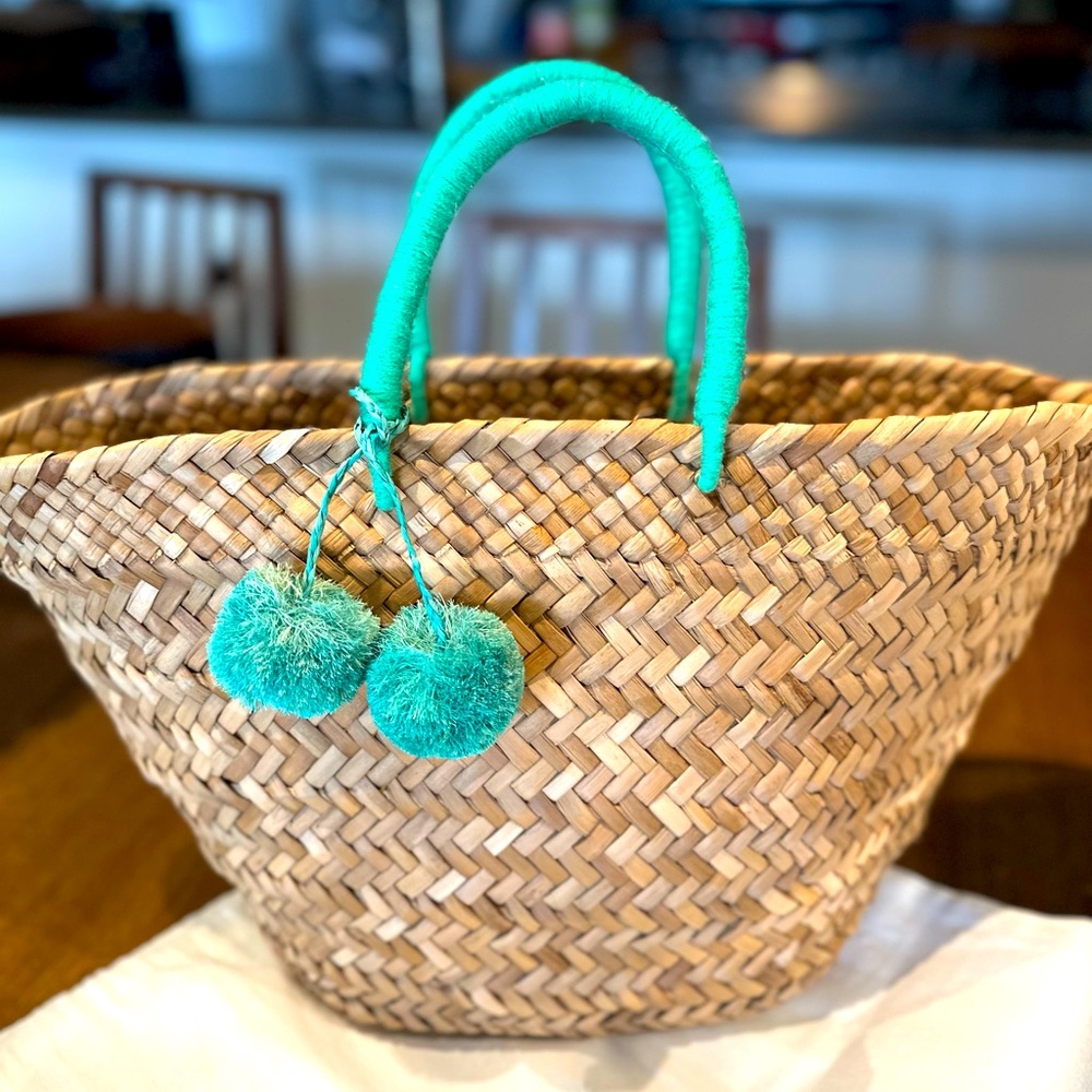 Kayu large straw tote with teal pom poms